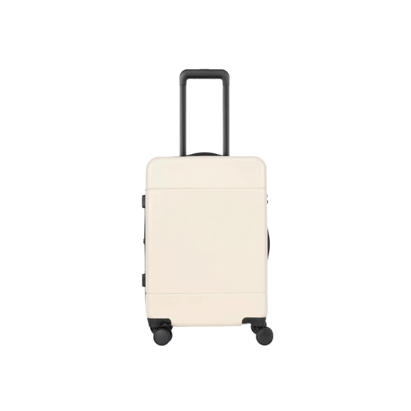 A foto mostra uma mala de bordo da marca Calpak na cor off-white.